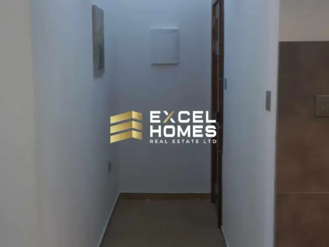 a door is open to a hallway with a door