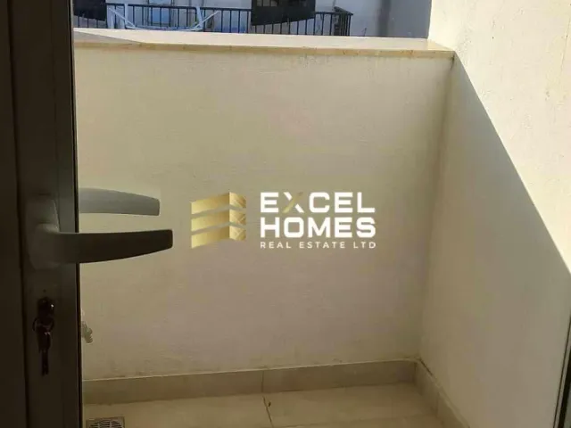 a toilet bowl with a bottle of water next to it