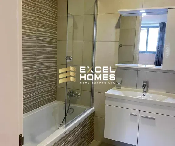 a bathroom with a sink, toilet and shower