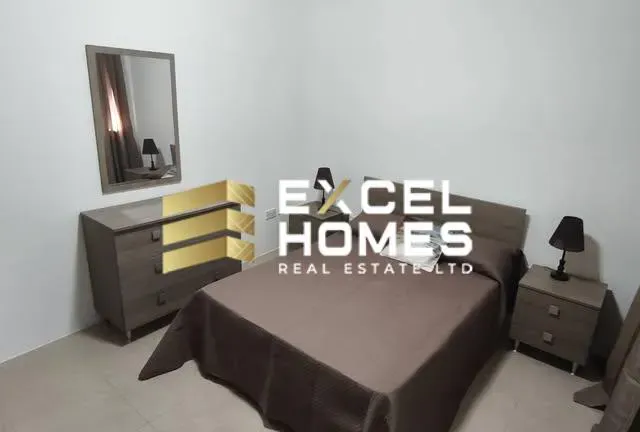 a bed with a large bedspread and a large television