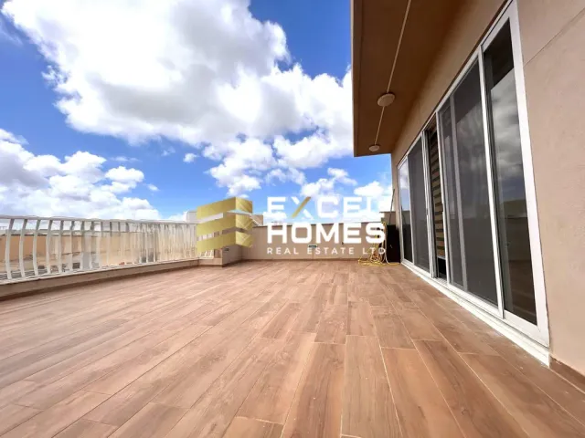 a large white building with a balcony
