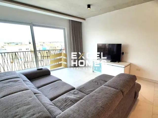 a living room with a couch and a television