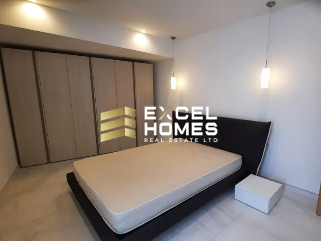 a bed with a white bedspread and a white bedspread