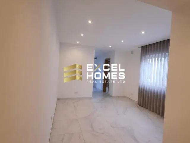 a room with a white wall and a white floor