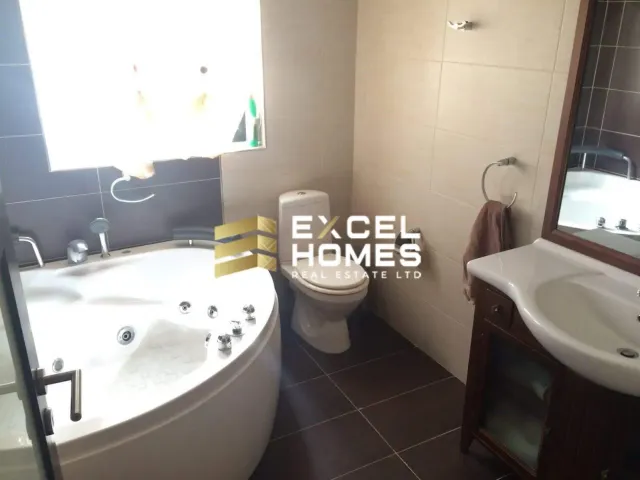 a bathroom with a toilet, sink, and bathtub