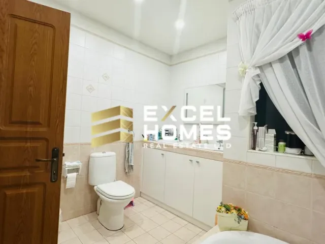 a bathroom with a toilet, sink, and bathtub