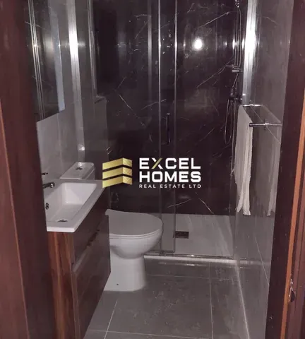 a bathroom with a toilet and a sink