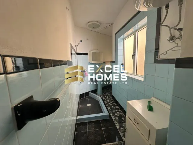 a bathroom with a sink, toilet and tub