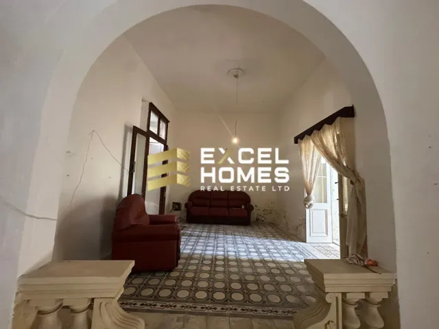 a room with a stairway leading to a stairway