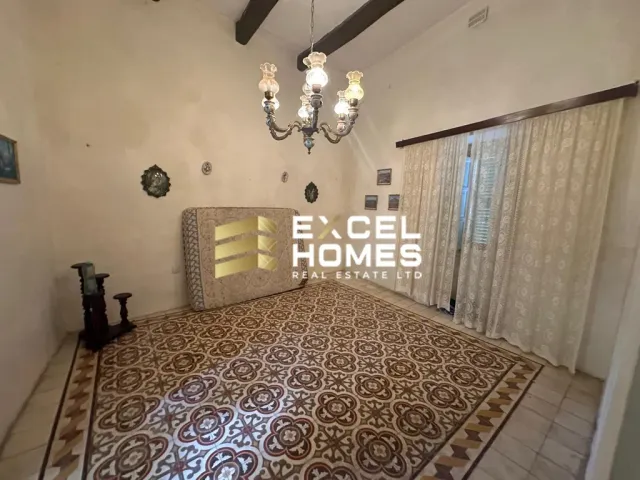 a large room with a large mirror and a rug