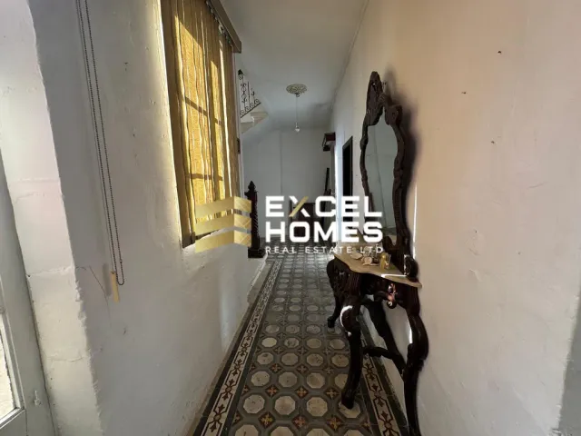 a horse is walking down the street