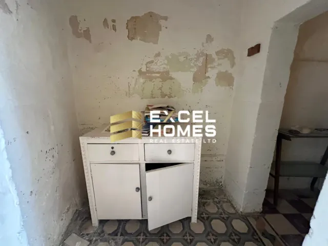 a bathroom with a sink and a shelf