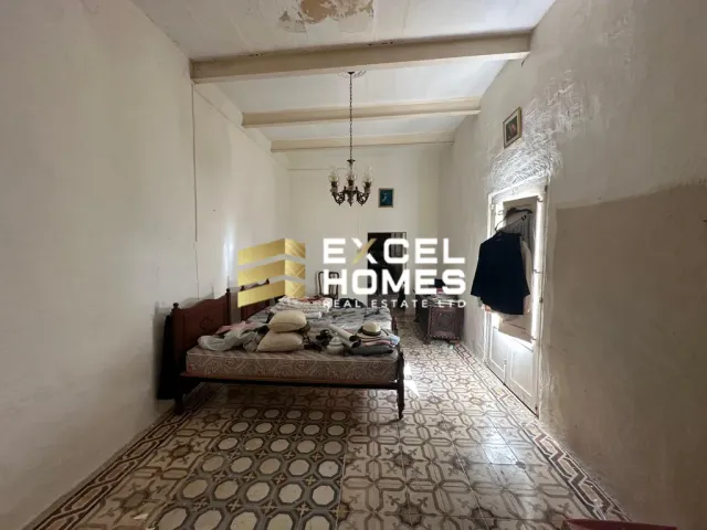 a living room with a couch and a rug