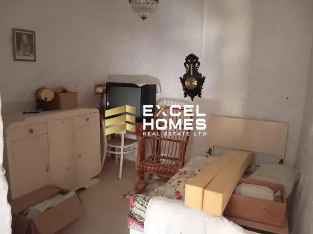 a living room with a tv and a couch