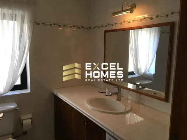 a bathroom with a mirror and a sink