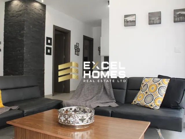 a living room with a couch, coffee table and a coffee table