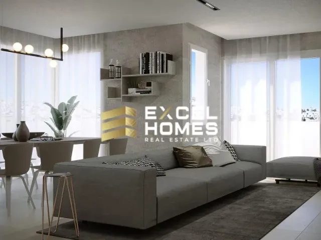 a living room with a couch, table, and a television 