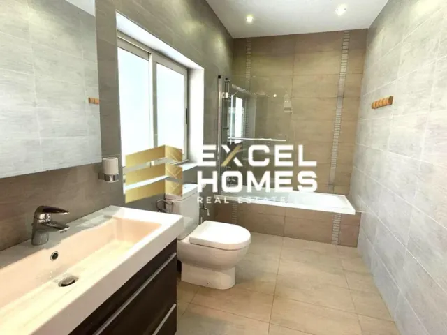 a bathroom with a toilet, sink, and bathtub