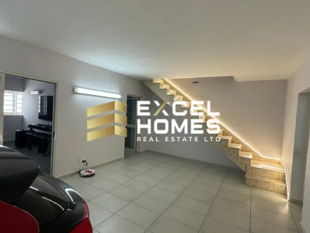 a room with a large mirror and a floor