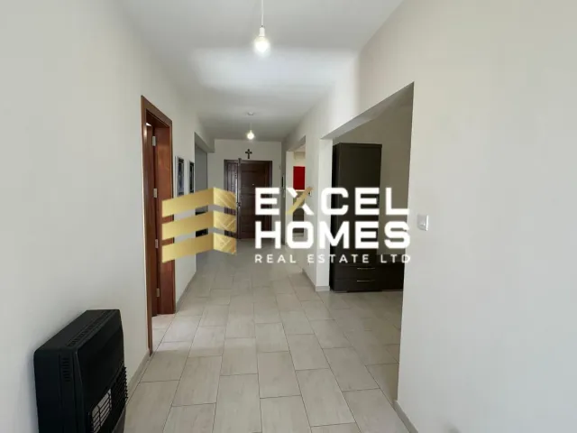 a room with a door and a wall with a rug