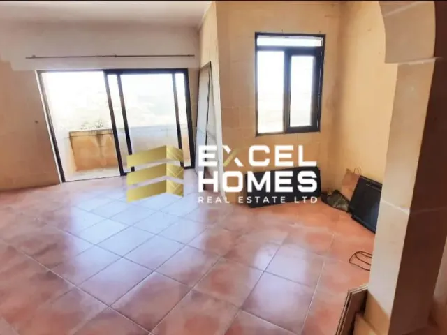 a room with a door open and a window