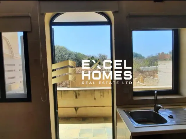 a bathroom with a toilet and a window