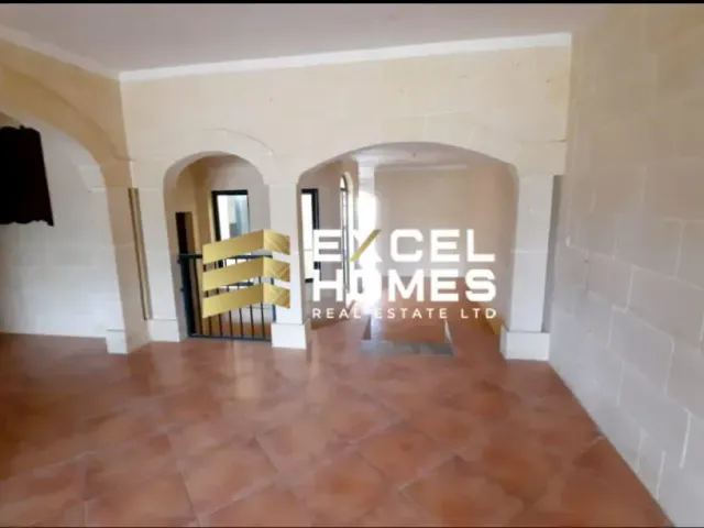 a wall with a painting of a man in a wheelchair