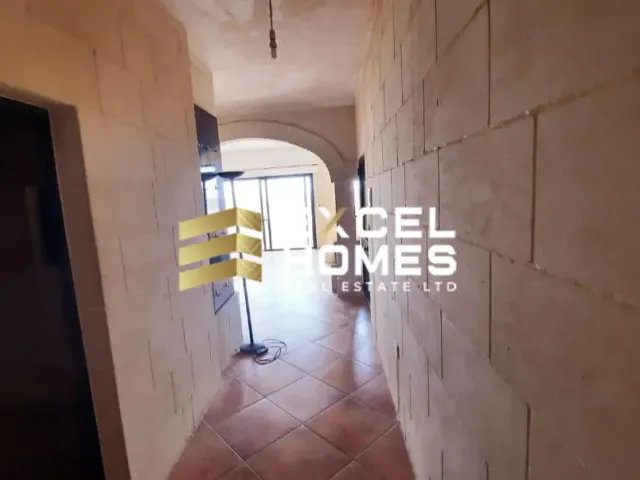 a building with a yellow wall and a blue wall