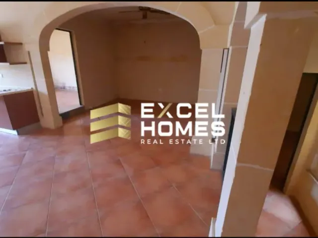 a doorway leading to a room with a staircase