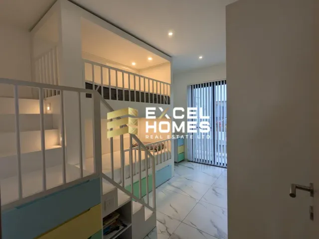 a room with a staircase and a window 