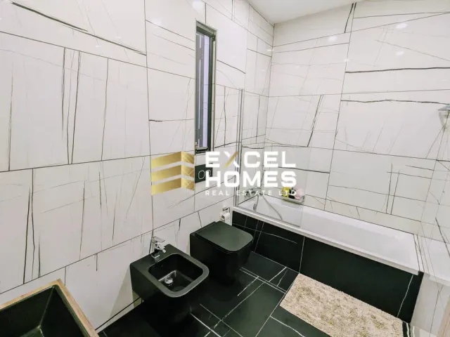 a bathroom with a sink, toilet and a mirror 