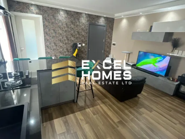 a living room with a tv and a couch