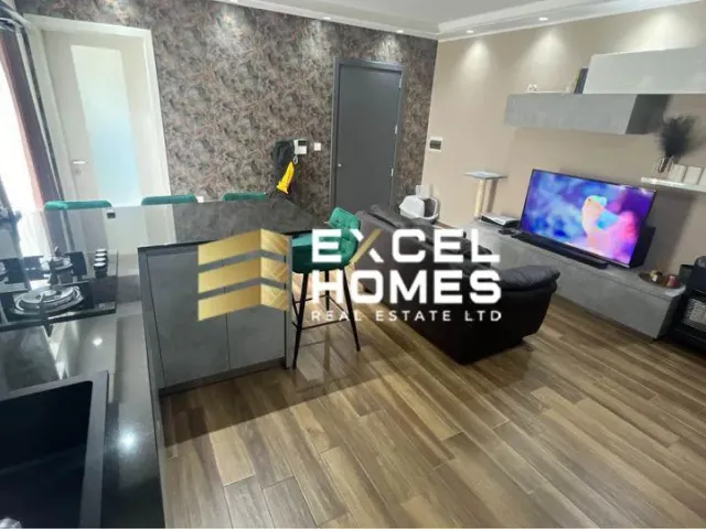 a living room with a tv and a couch