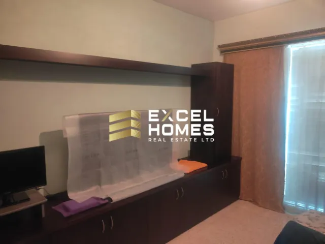 a room with a wall of glass and a window