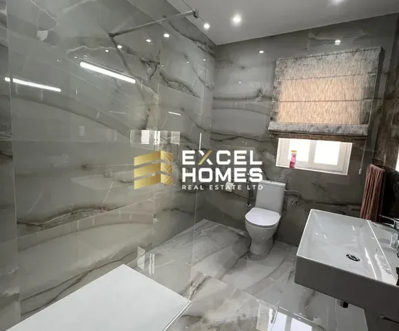 a bathroom with a toilet, sink, and bathtub