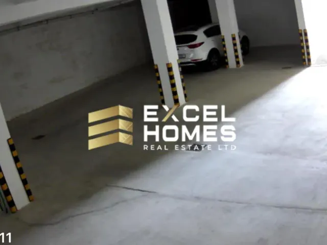 a dog sitting on a concrete floor