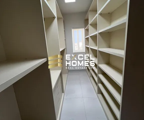 a room with a shelf filled with shelves