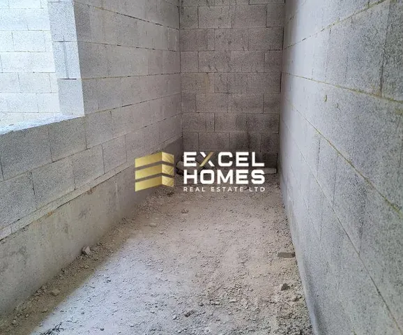 a wall with a broken down toilet and graffiti