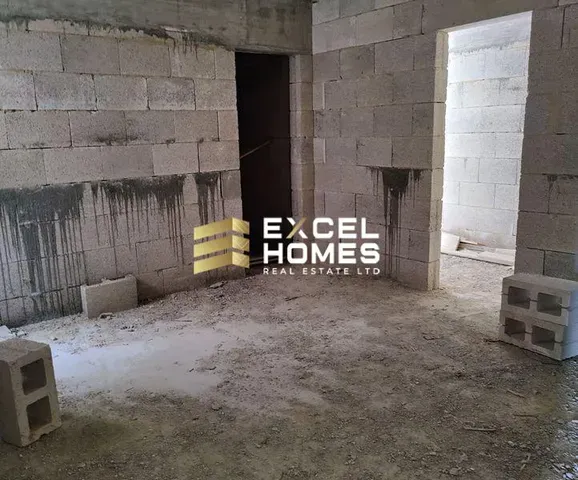 a room with a wall with a wall of bricks and a wall of bricks