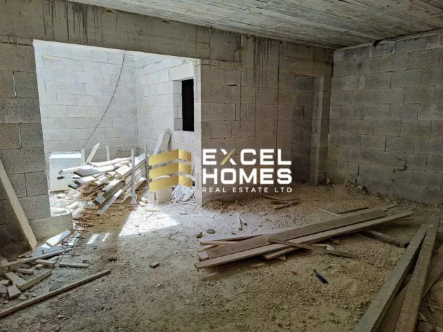 a broken down building with a broken down wall