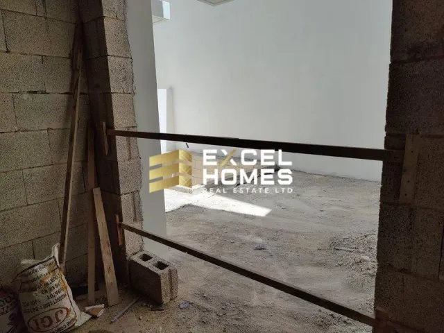 a door is open in a room with a wall