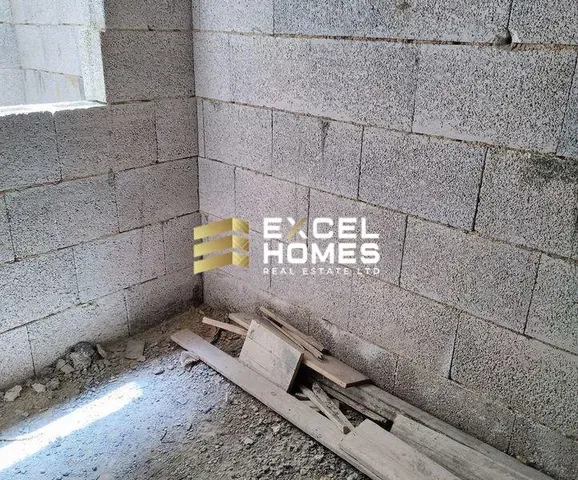 a broken wall with a broken sign on it