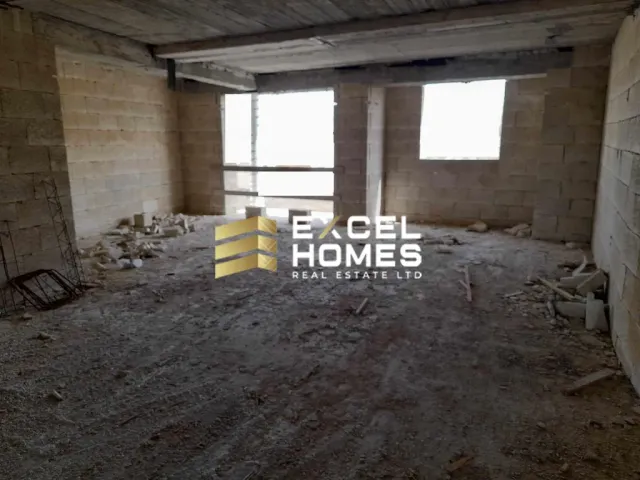 a room with a wall of bricks and a wall of bricks