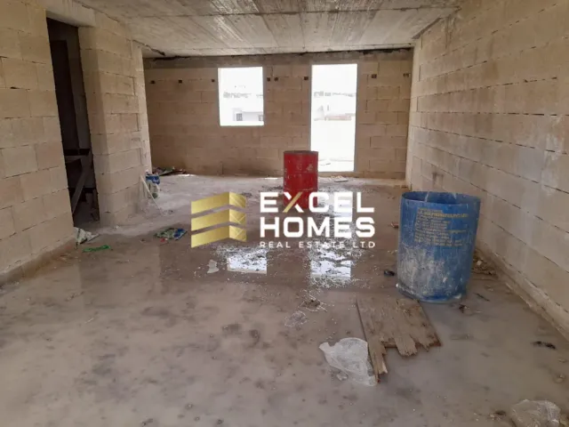 a room with a bunch of trash cans and a wall