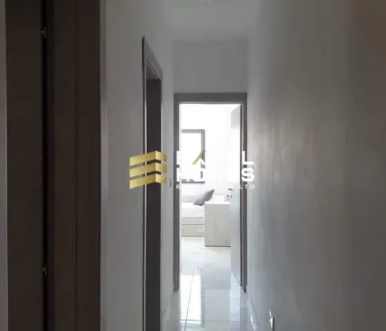 a door is open to a room with a door open