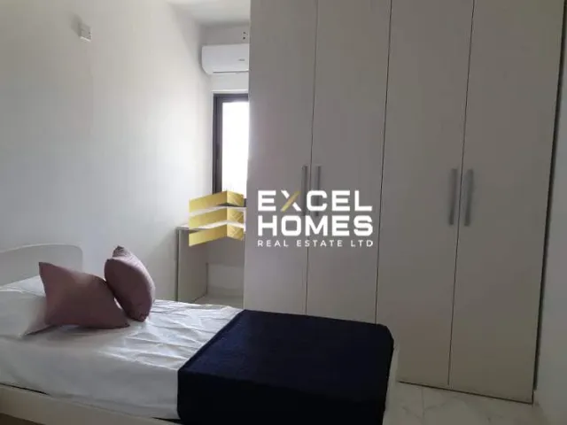 a bed with a white bedspread and a white bedspread