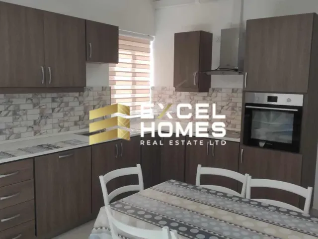 a kitchen with a stove, microwave, and refrigerator