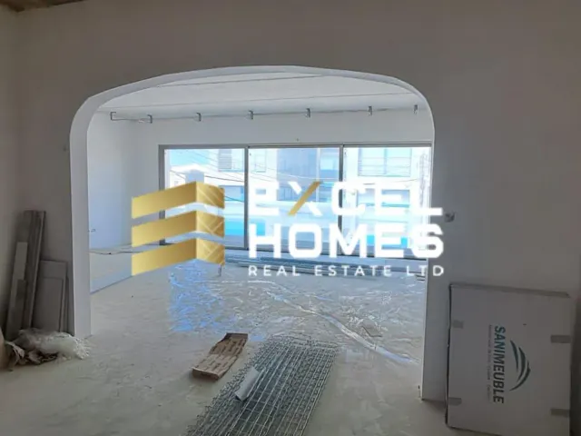 a room with a building and a building with a skateboard 
