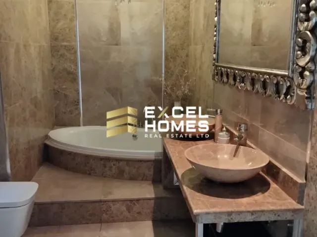 a bathroom with a sink, toilet and bathtub