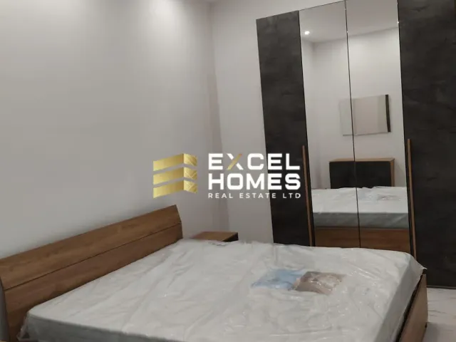 a bed with a white bedspread and a white bedspread